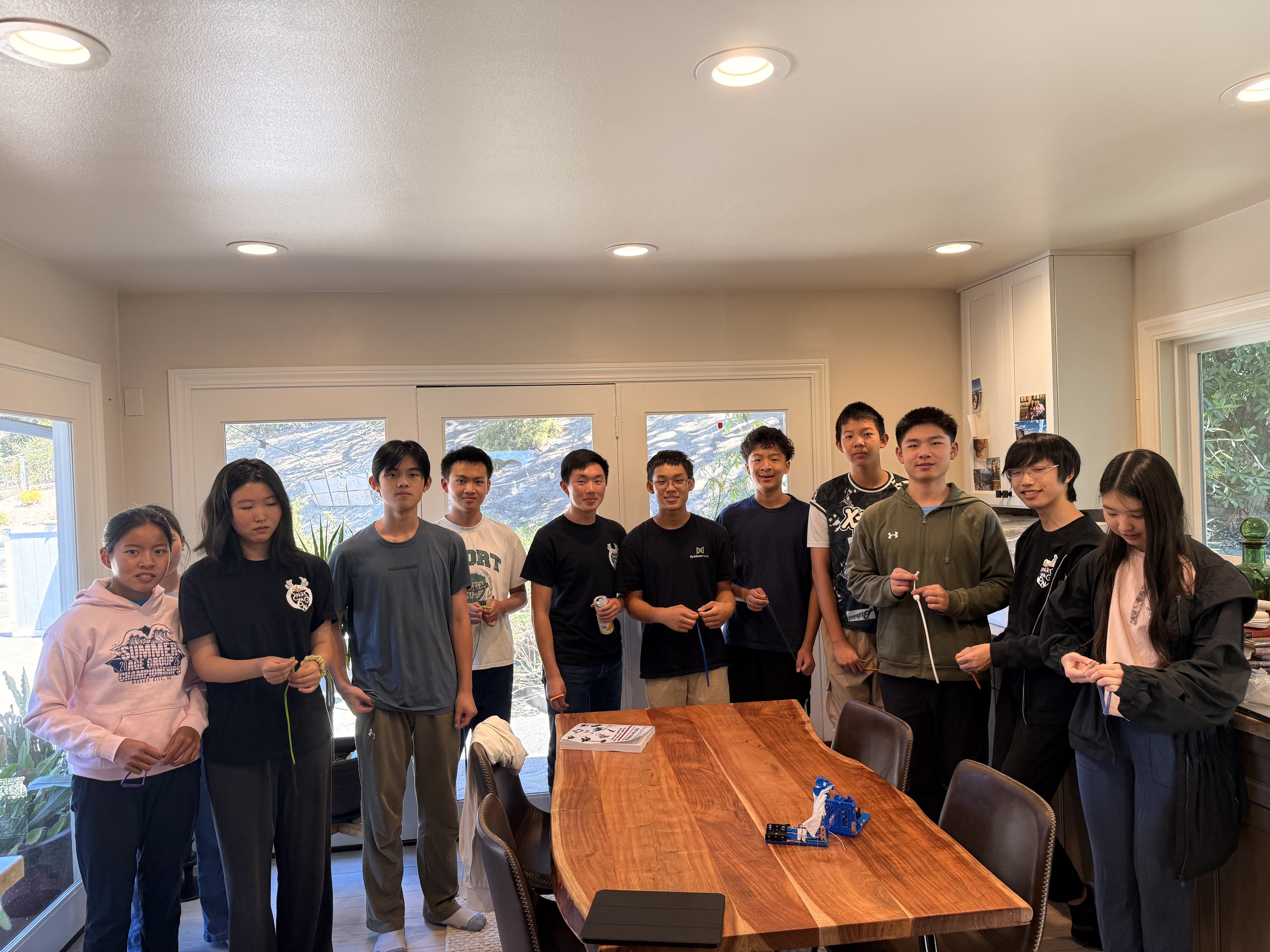 Paragon team members standing together around a worktable